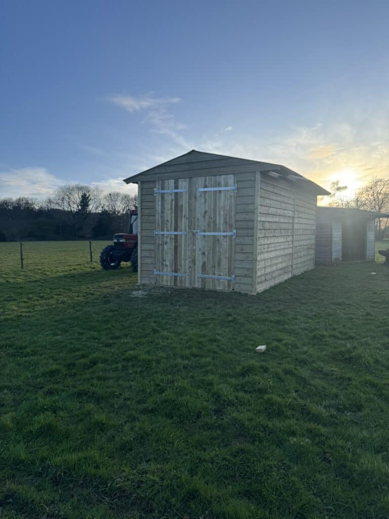 Custom designed and built tractor shed, crafted by Sussex Stables, June 2023