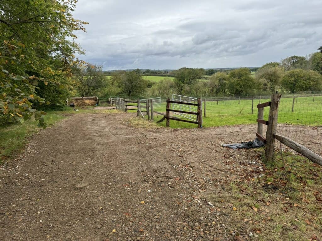 Run of equestrian fencing and gateways installed by Sussex Stables