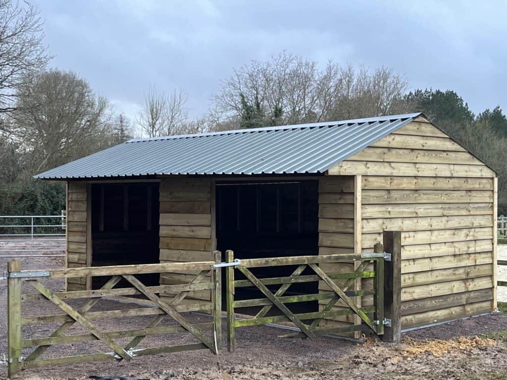 Double field shelter built by Sussex Stables, forming part of a larger complex for the rehabilitation of injured horses.