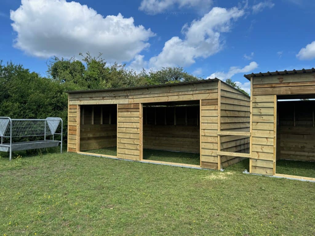 Single and double pent roof field shelters, constructed by Sussex Stables, Summer 2025
